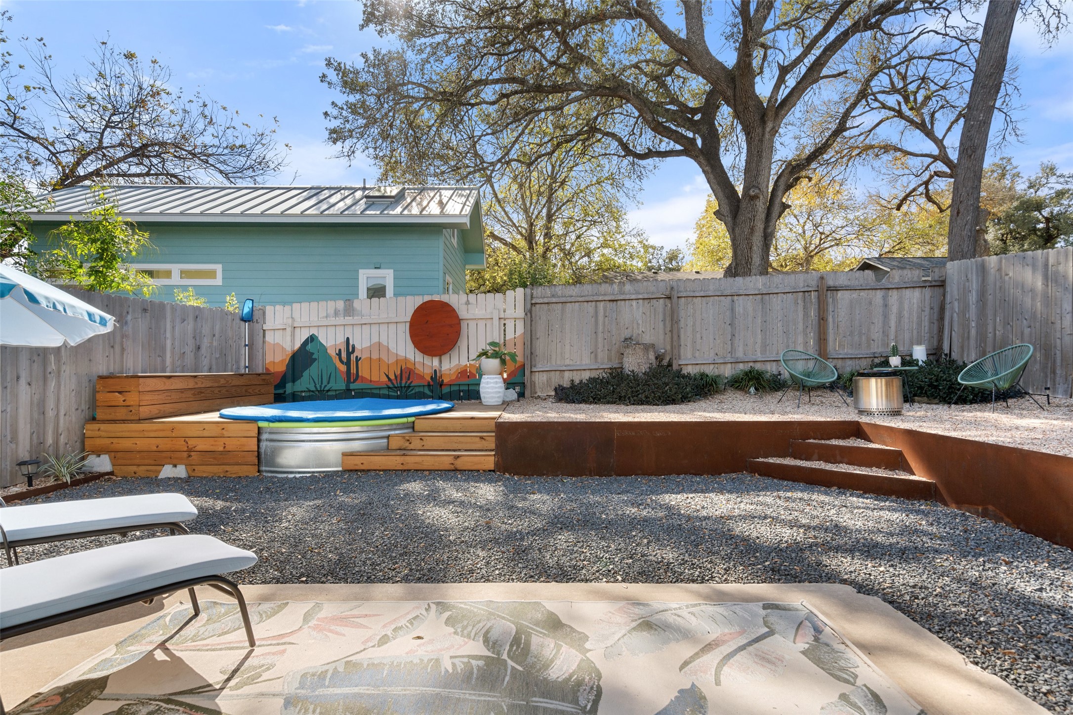 909 Milford Way, Unit B Austin, TX 78745 - Photo 1 of 1 a view of a backyard with swimming pool