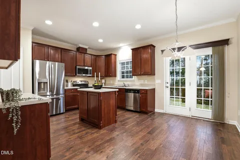 a living room with furniture window and wooden floor