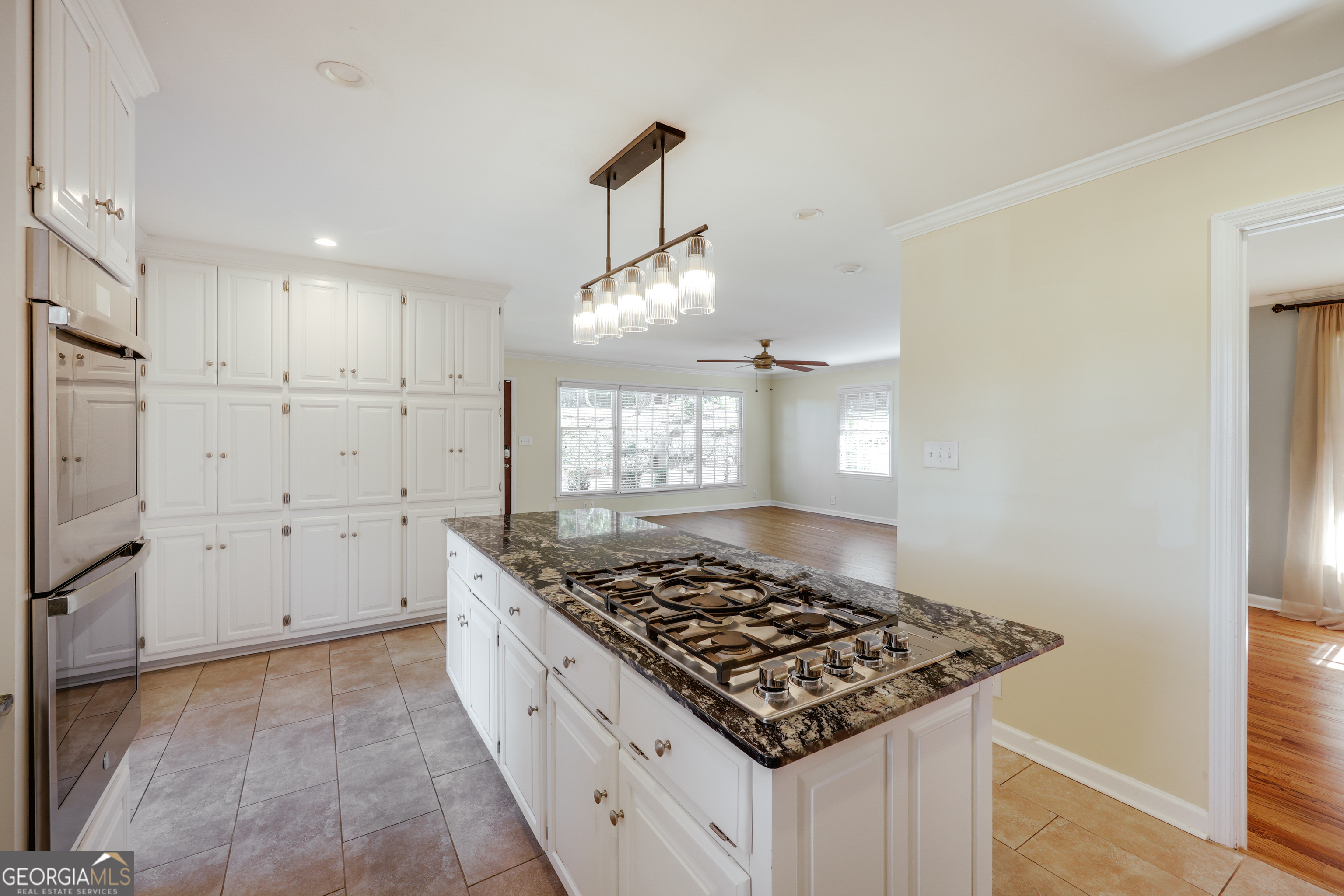 206 Fortson Drive Athens, GA 30606 - Photo 12 of 54 a kitchen with a stove and a wooden floor
