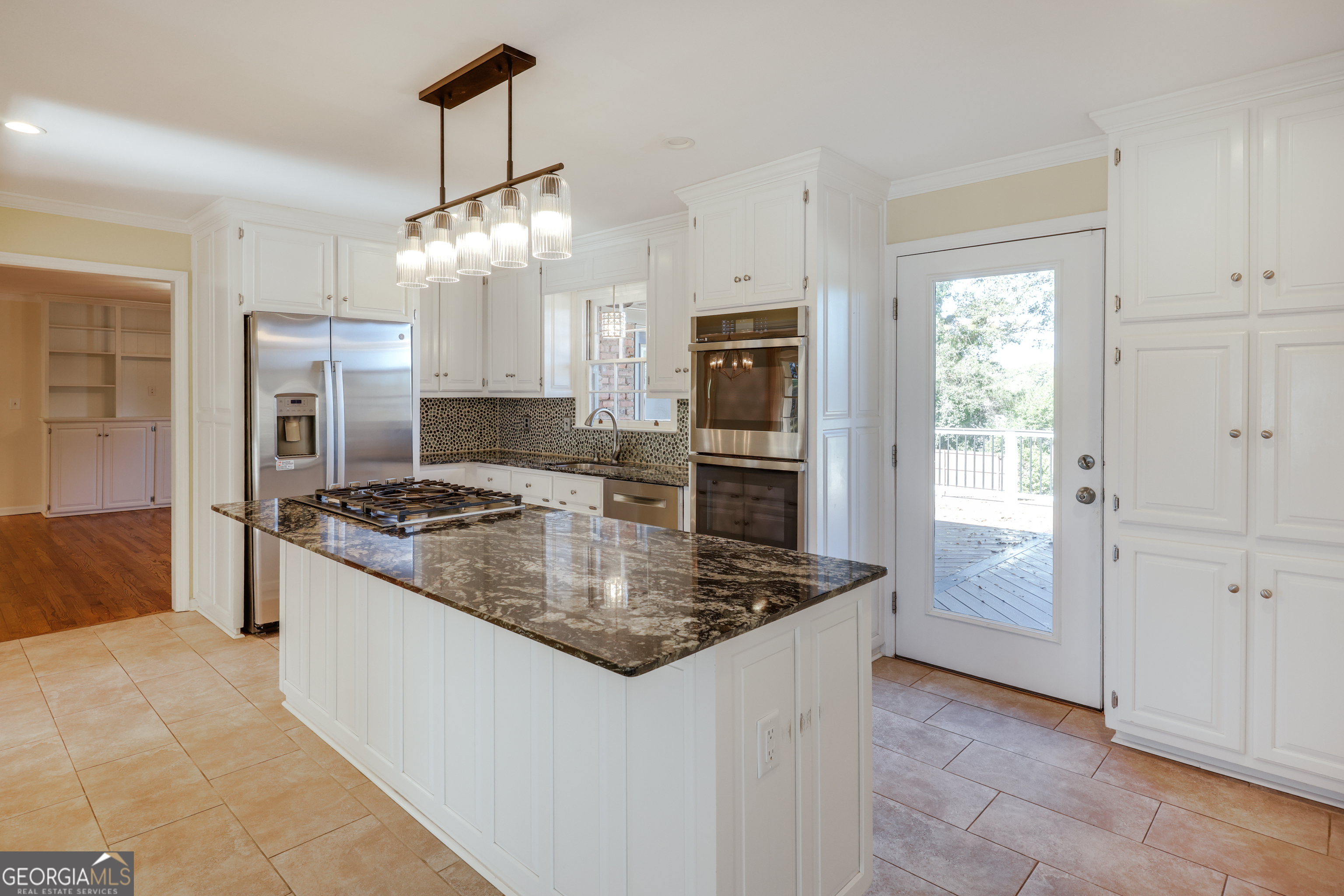 206 Fortson Drive Athens, GA 30606 - Photo 14 of 54 a kitchen with stainless steel appliances granite countertop a stove a refrigerator and a sink