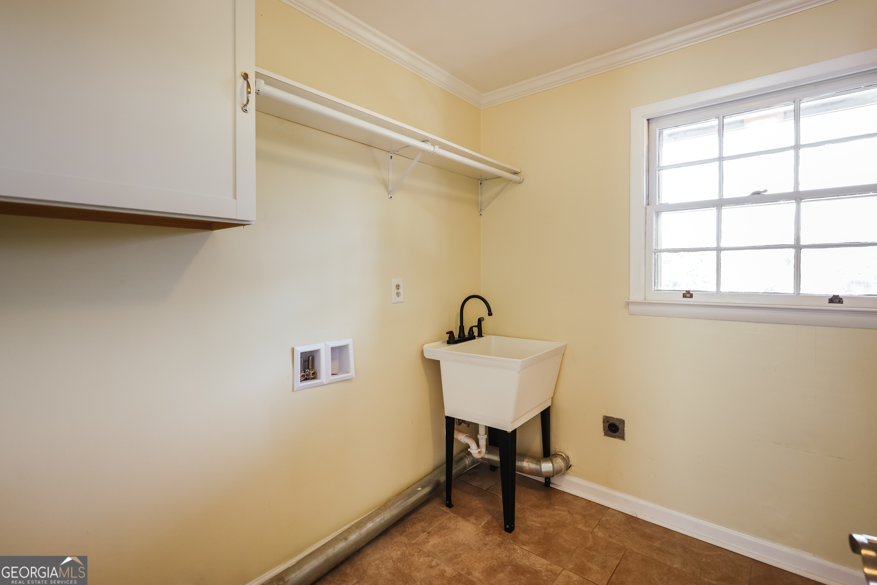 206 Fortson Drive Athens, GA 30606 - Photo 15 of 48 a view of a bathroom with a sink and a window