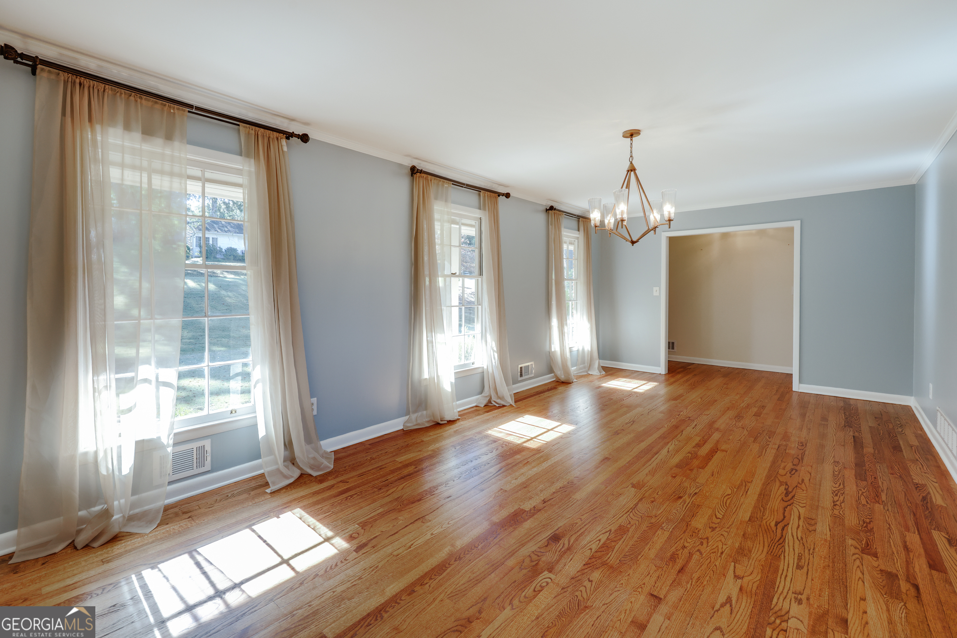 206 Fortson Drive Athens, GA 30606 - Photo 16 of 48 a view of an empty room with wooden floor and a window