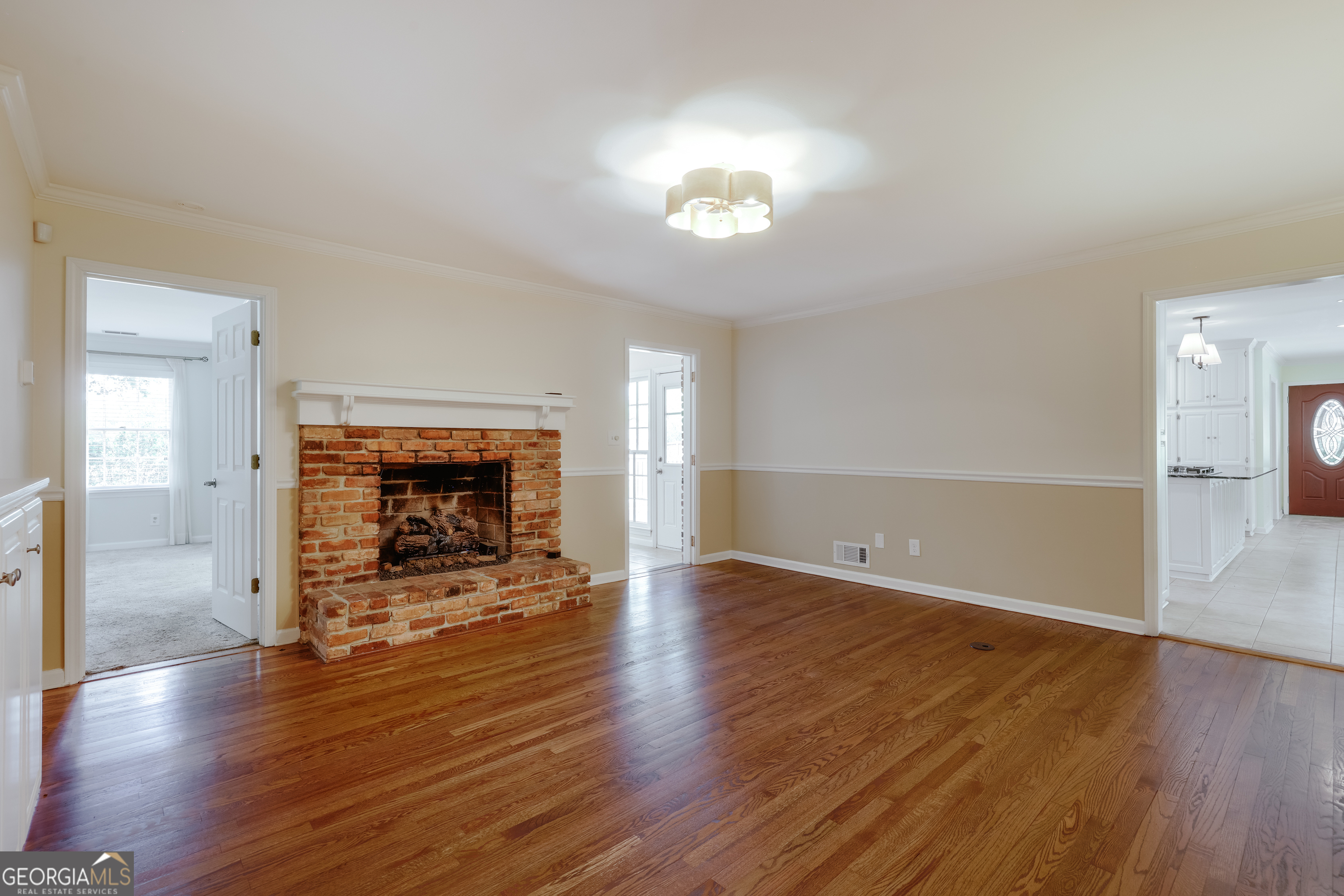 206 Fortson Drive Athens, GA 30606 - Photo 20 of 48 an empty room with wooden floor fire place and windows