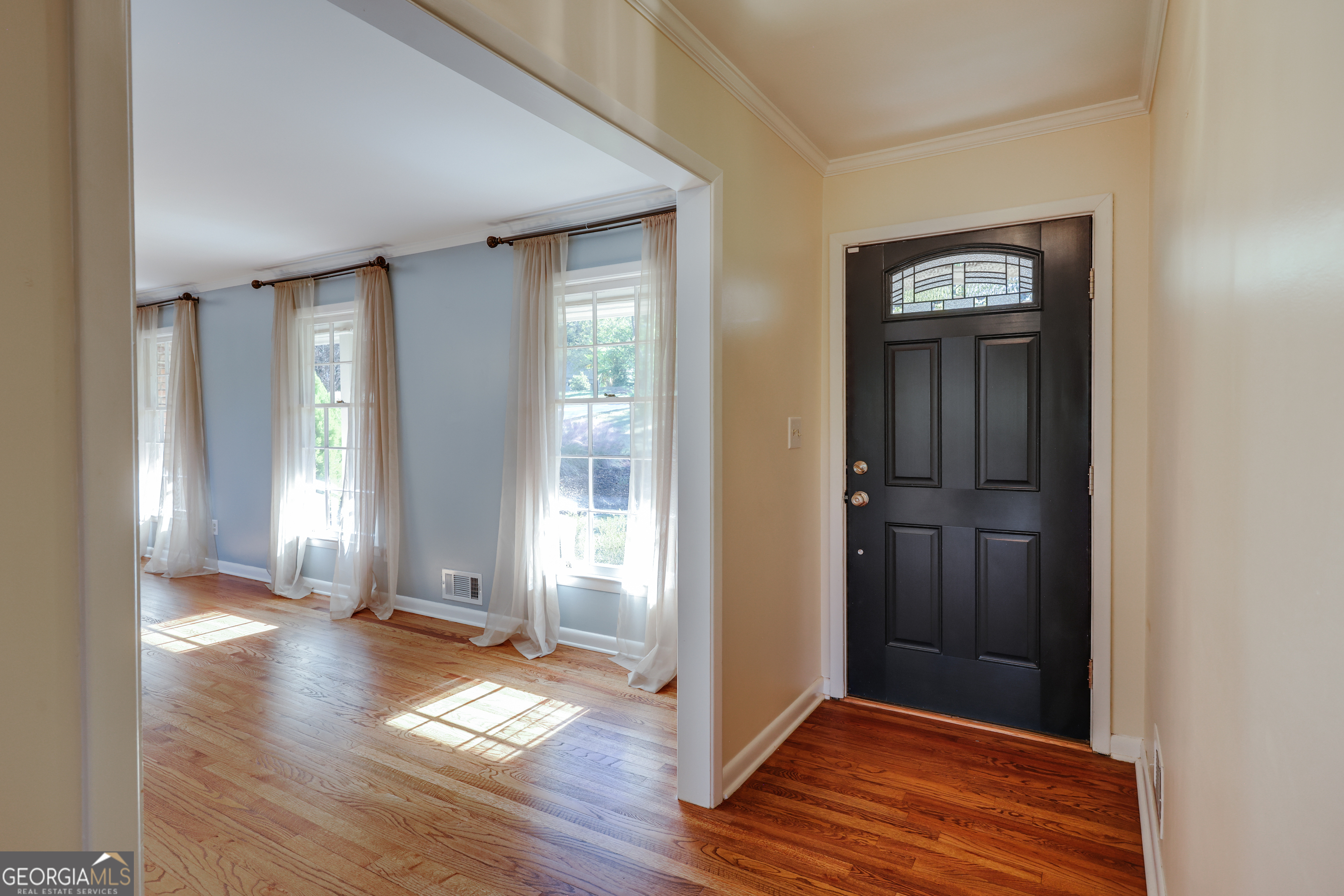 206 Fortson Drive Athens, GA 30606 - Photo 2 of 54 an empty room with wooden floor front door and windows