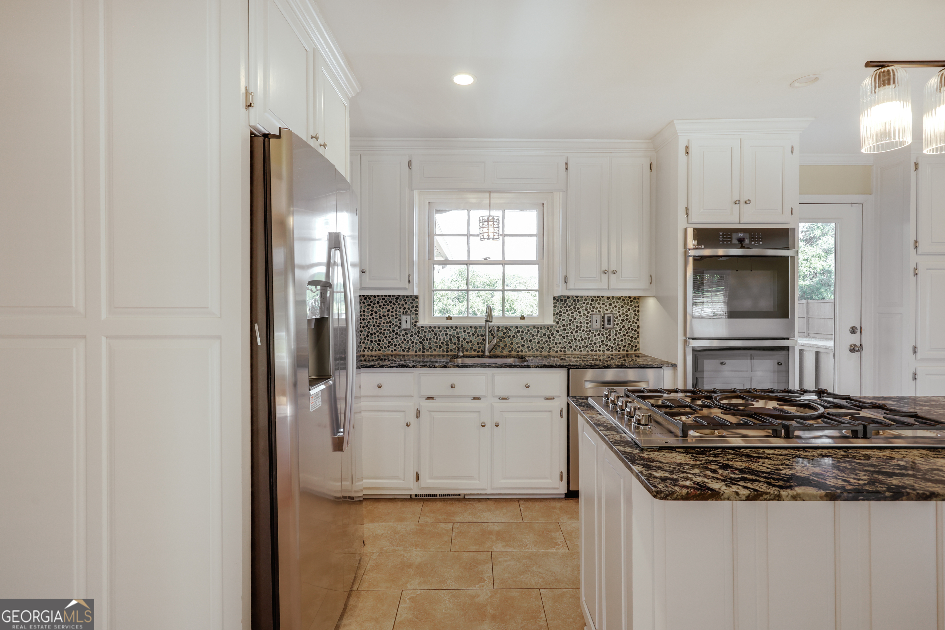 206 Fortson Drive Athens, GA 30606 - Photo 3 of 54 a kitchen with stainless steel appliances granite countertop a stove and a refrigerator