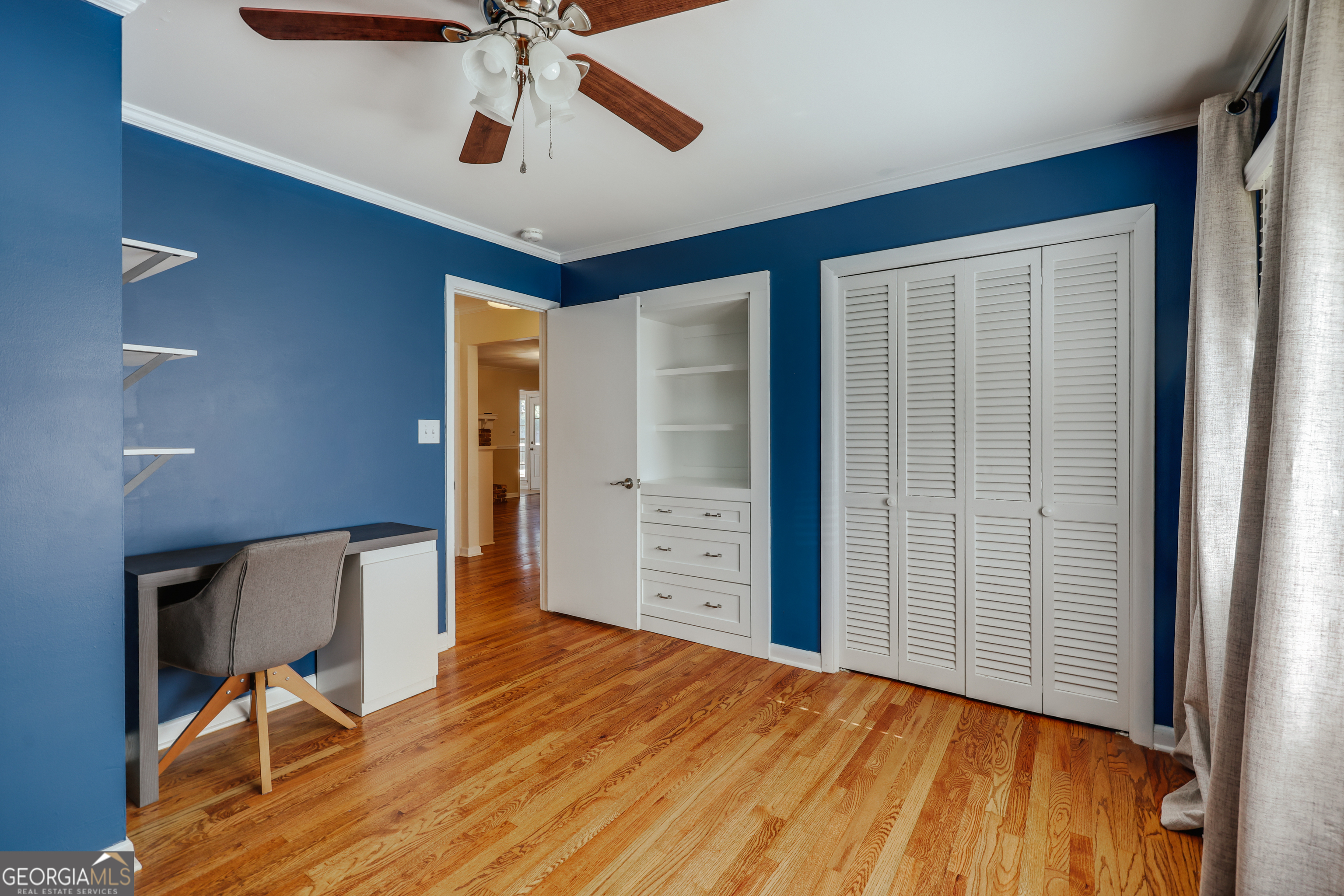 206 Fortson Drive Athens, GA 30606 - Photo 37 of 54 a view of a livingroom with wooden floor and a ceiling fan
