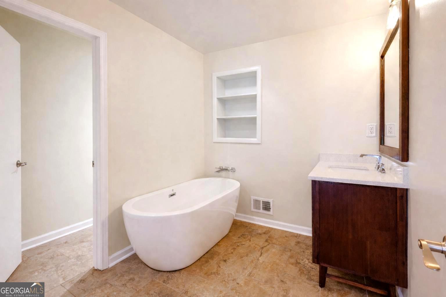 206 Fortson Drive Athens, GA 30606 - Photo 38 of 54 a bathroom with a bathtub and sink