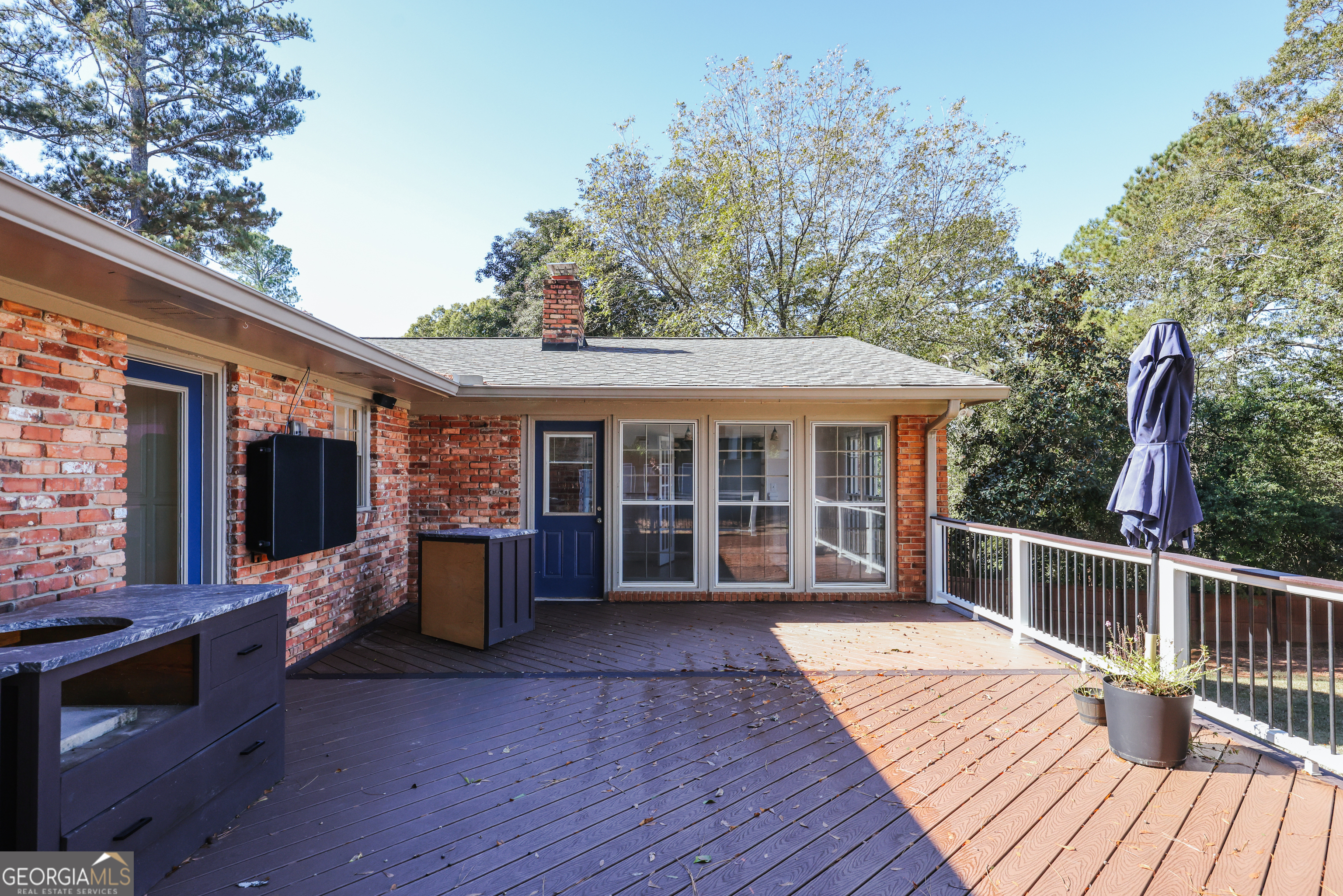 206 Fortson Drive Athens, GA 30606 - Photo 42 of 48 a view of a house with a barbeque and wooden deck