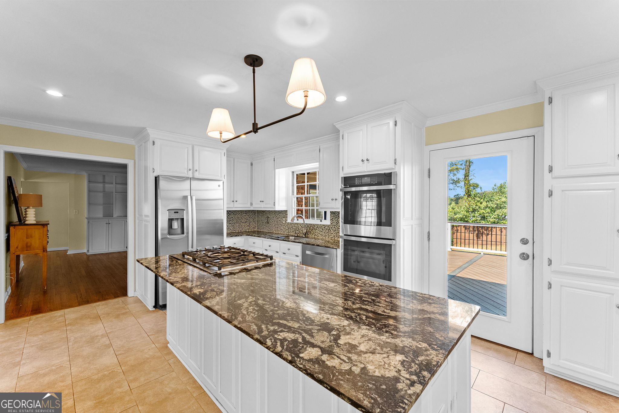206 Fortson Drive Athens, GA 30606 - Photo 5 of 54 a kitchen with stainless steel appliances granite countertop a sink refrigerator and stove