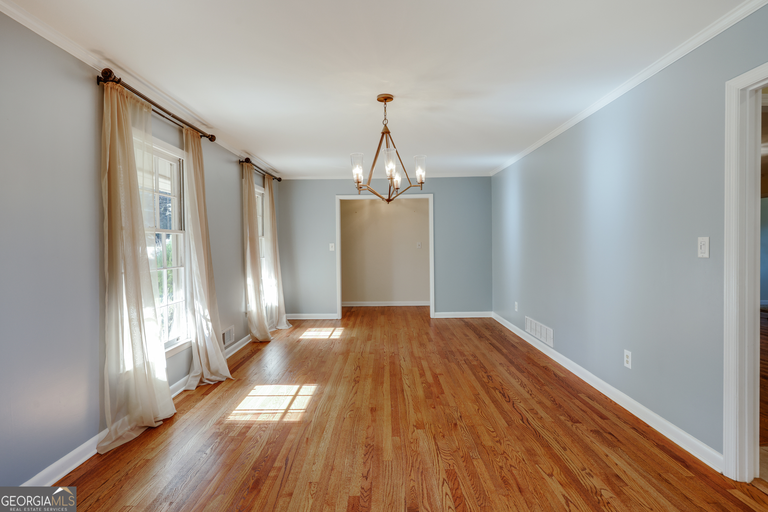 206 Fortson Drive Athens, GA 30606 - Photo 7 of 54 a view of empty room with wooden floor and fan
