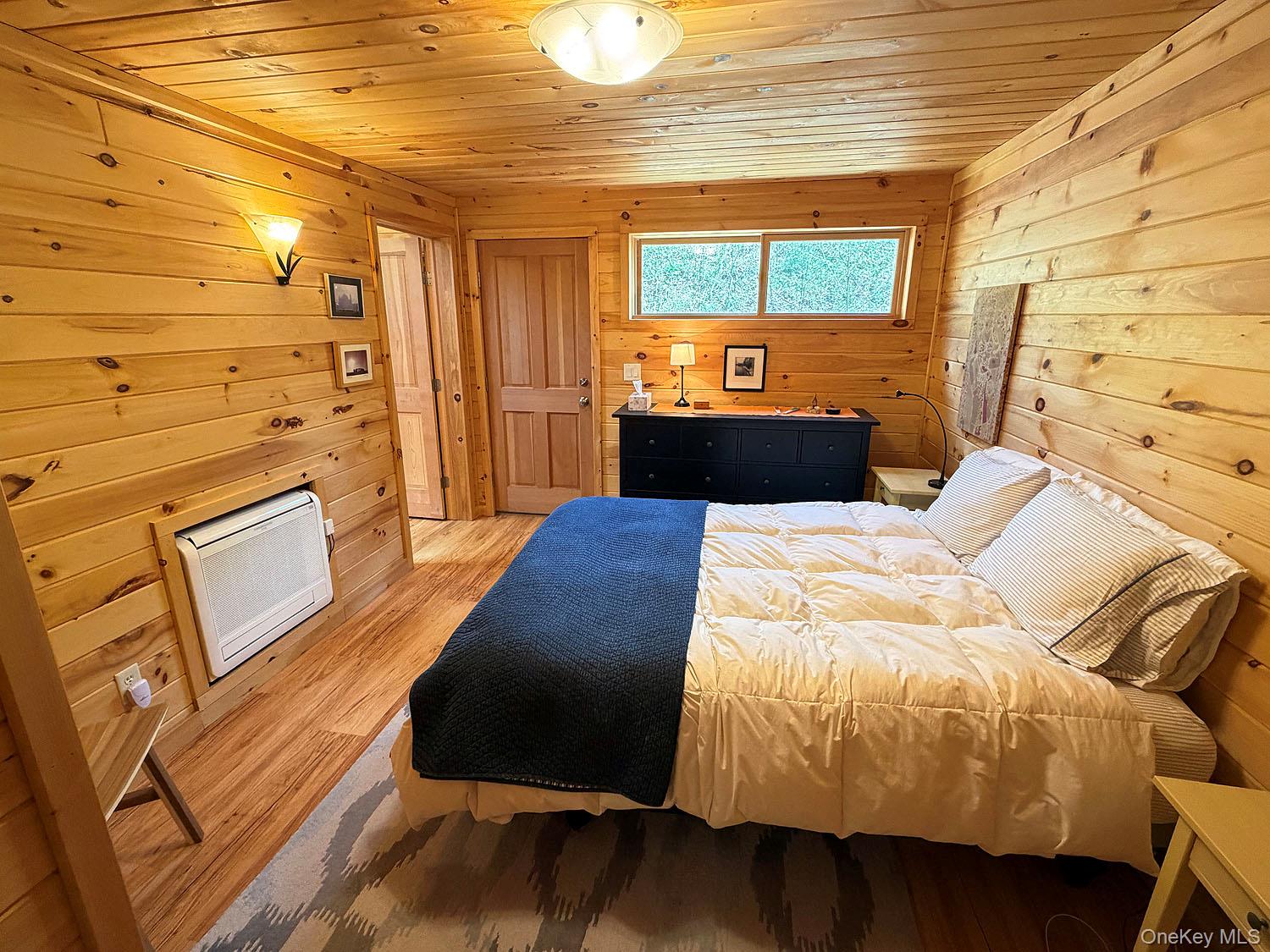 5120 Peas Eddy Road Hancock, NY 13783 - Photo 23 of 37 a bedroom with a bed and wooden floor