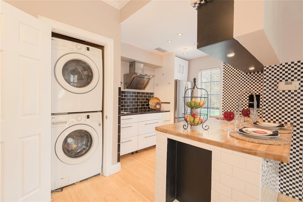 14333 Preston Road, Unit 2807 Dallas, TX 75254 - Photo 17 of 31 Laundry area with stacked washer / drying machine, light wood finished floors, and recessed lighting