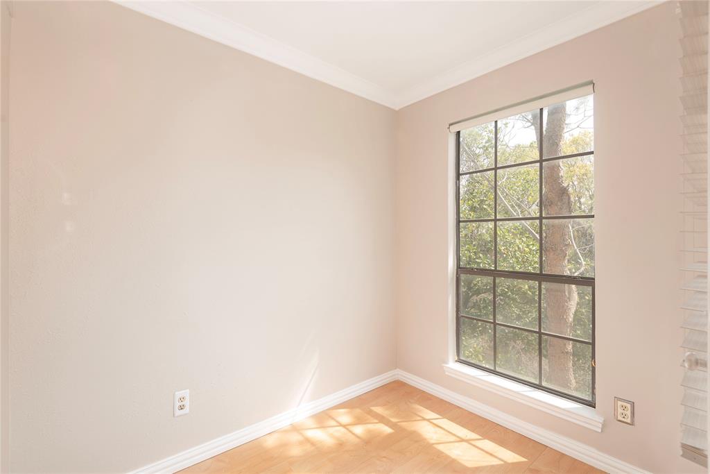14333 Preston Road, Unit 2807 Dallas, TX 75254 - Photo 21 of 31 Empty room with light wood finished floors and ornamental molding