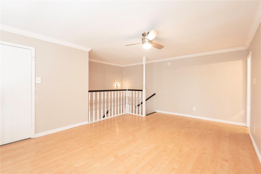 14333 Preston Road, Unit 2807 Dallas, TX 75254 - Photo 31 of 31 Empty room with ceiling fan, light wood-style flooring, and ornamental molding