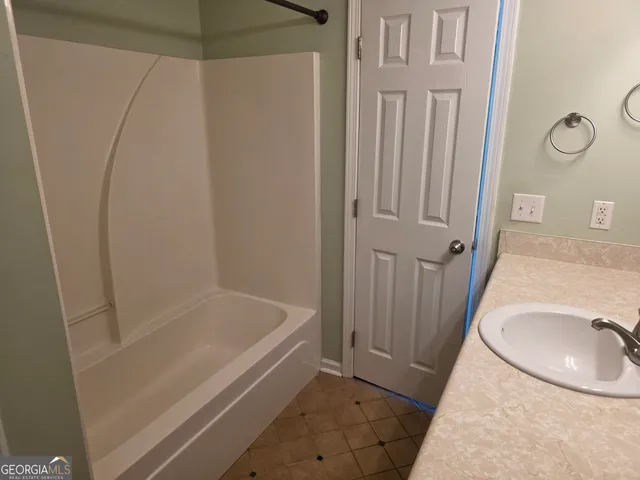 a bathroom with a sink and a tub