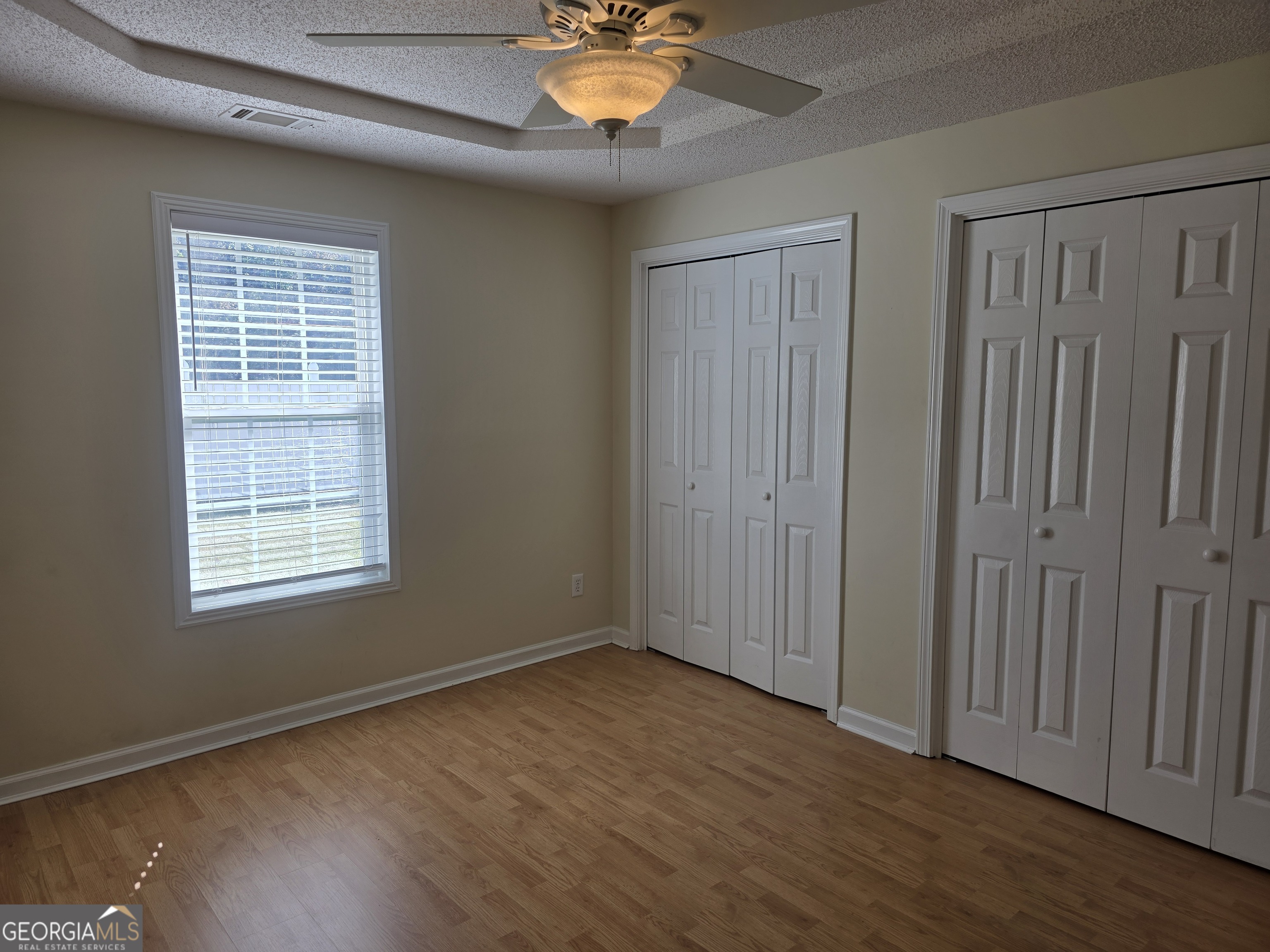 103 Reese Way Rincon, GA 31326 - Photo 16 of 21 a view of an empty room with window and wooden floor