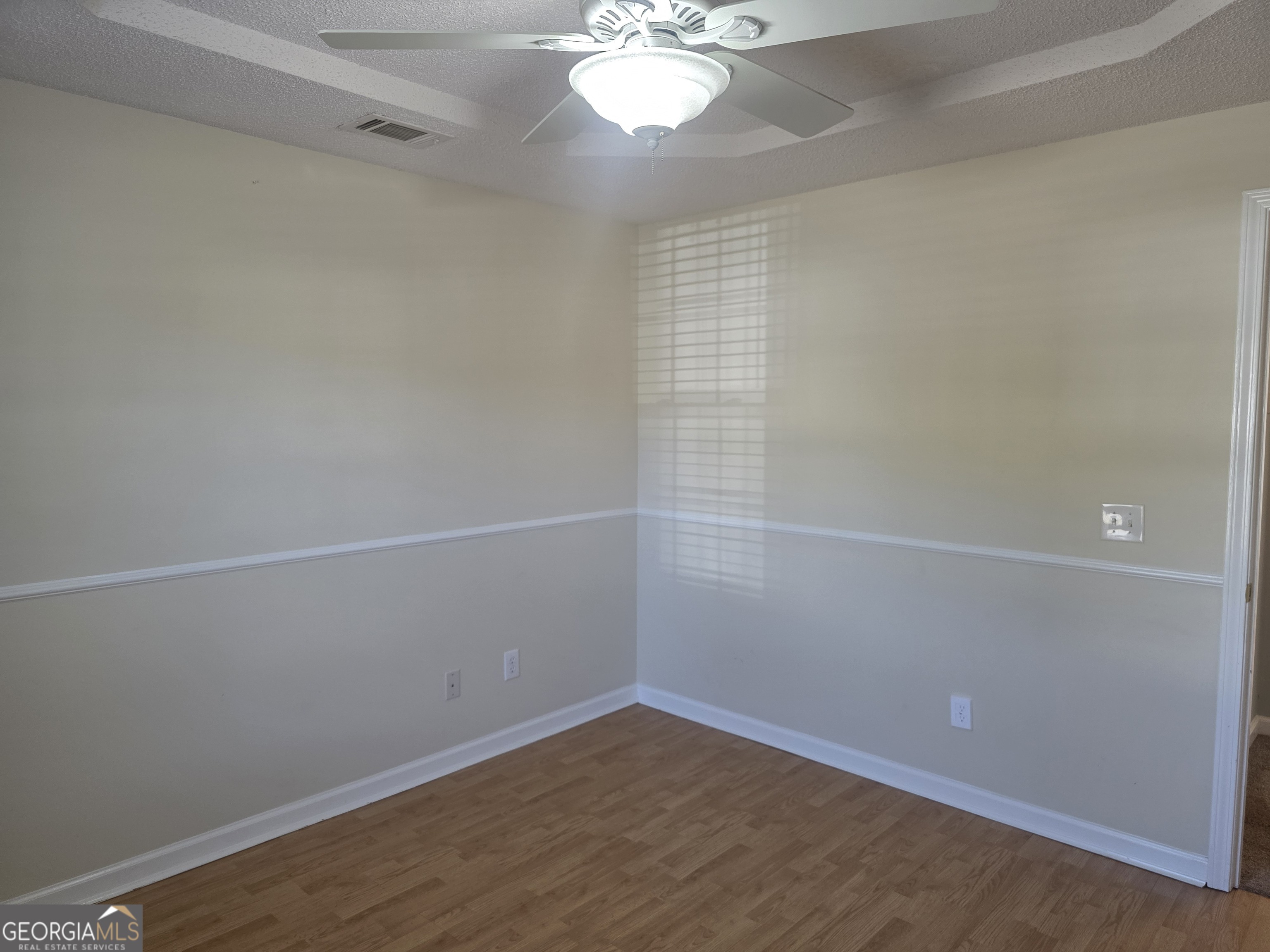103 Reese Way Rincon, GA 31326 - Photo 18 of 21 a view of a small space with wooden floor and fan