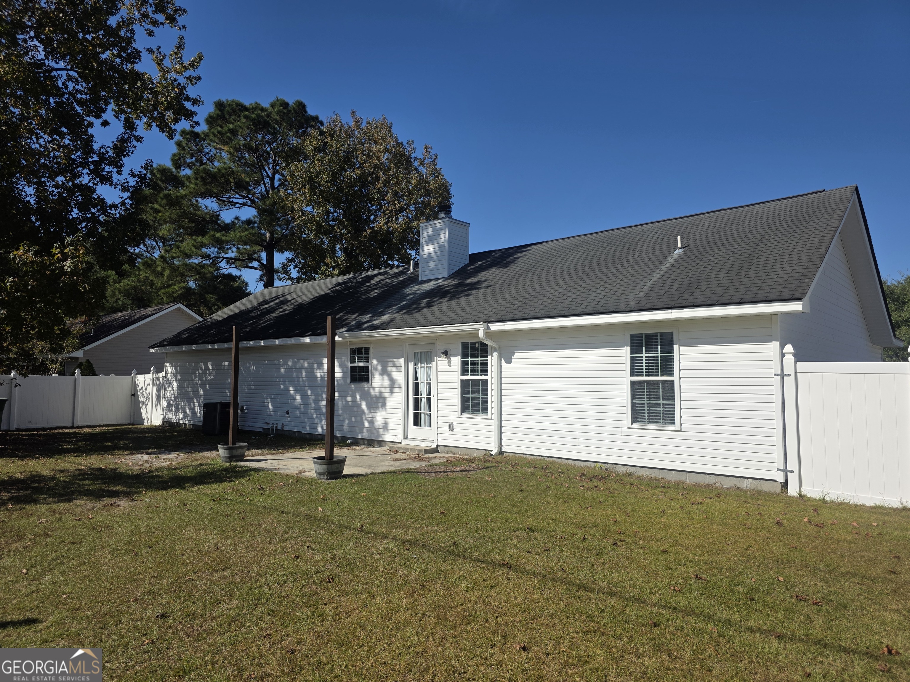 103 Reese Way Rincon, GA 31326 - Photo 20 of 21 a backyard of a house with lots of green space
