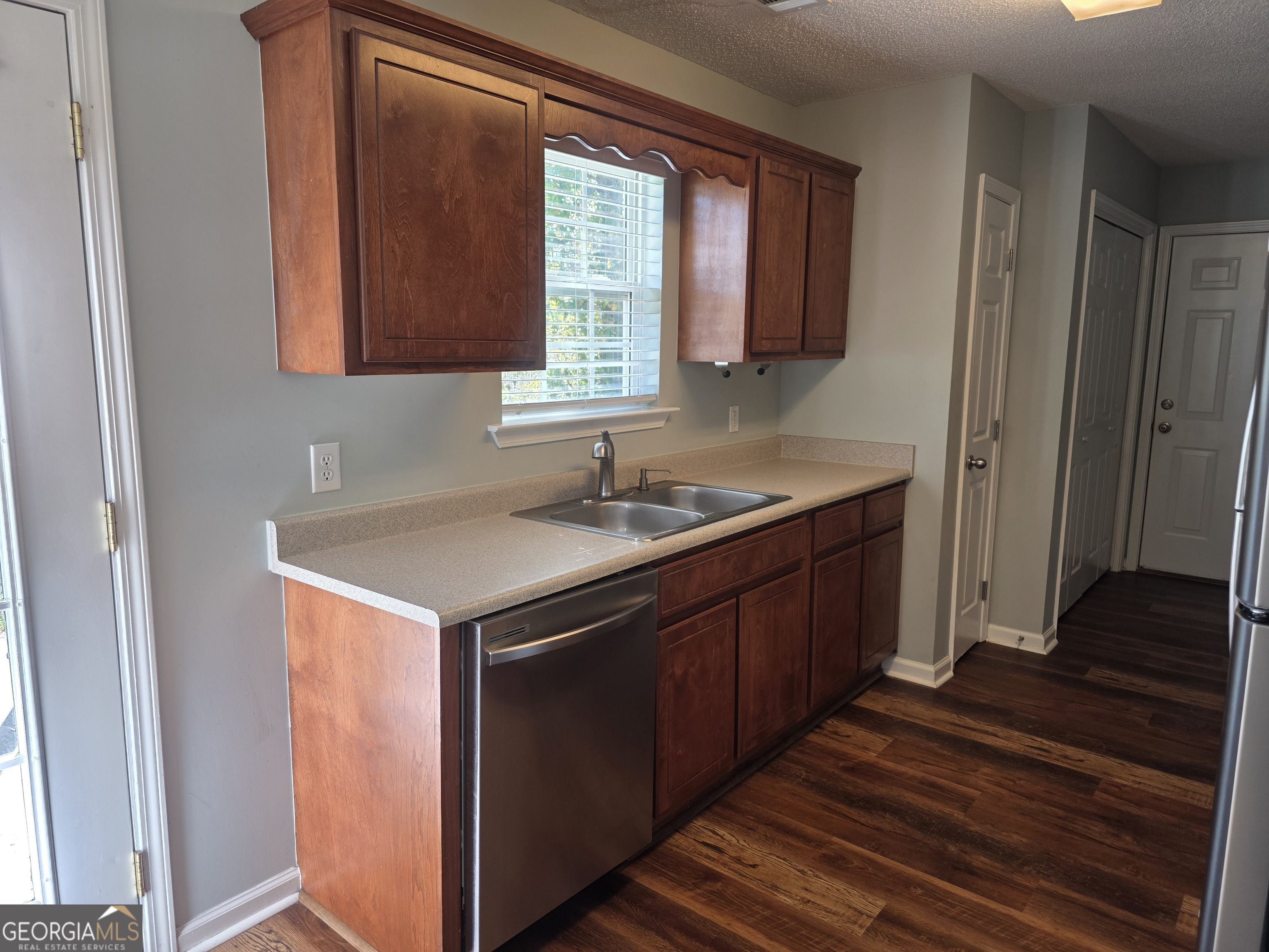 103 Reese Way Rincon, GA 31326 - Photo 8 of 21 a kitchen with a sink cabinets and wooden floor