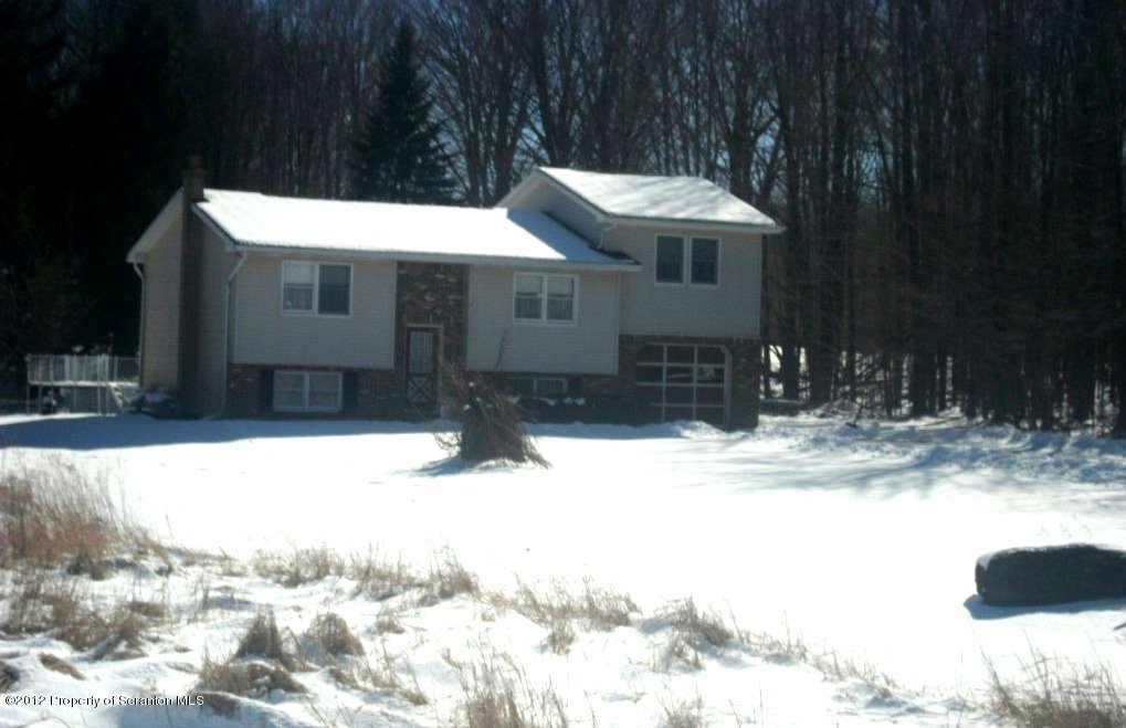a view of a house with snow on the ground