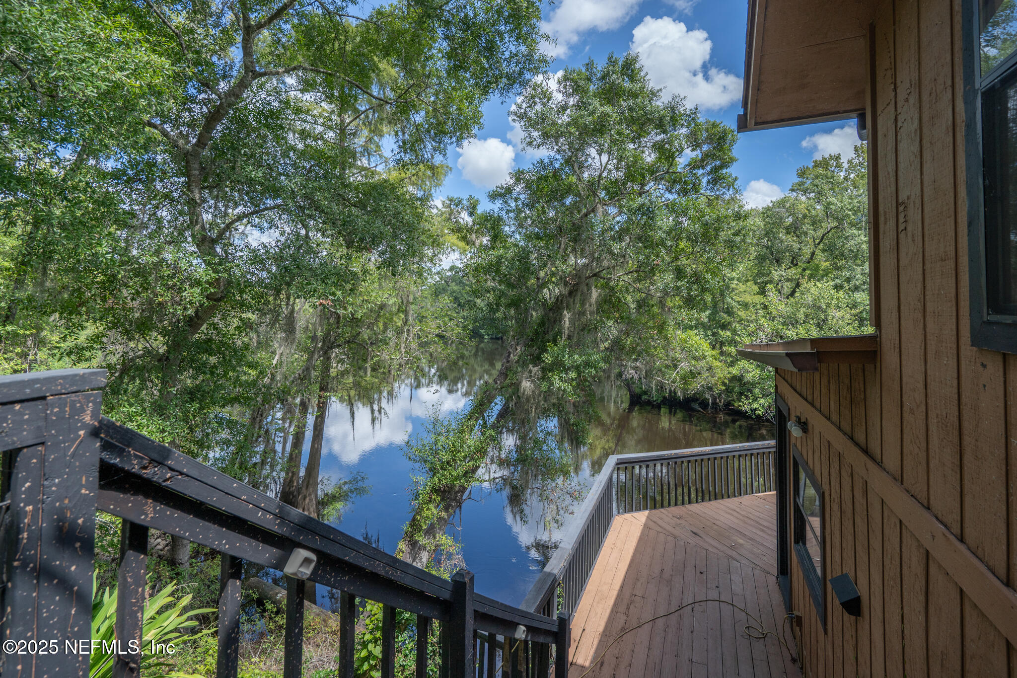 181040 Autumn Road Hilliard, FL 32046 - Photo 12 of 46 a balcony with wooden floor and outdoor space