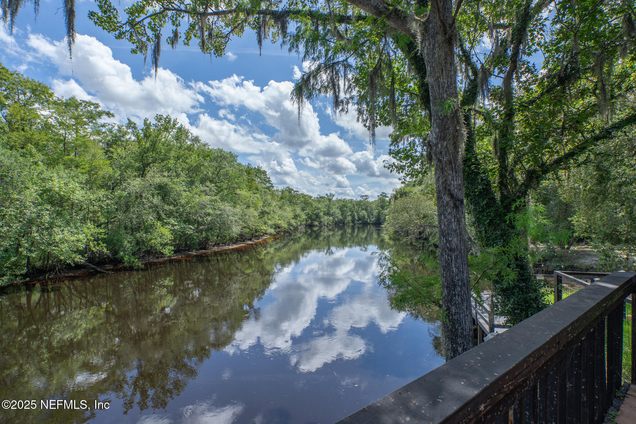 181040 Autumn Road Hilliard, FL 32046 - Photo 14 of 46 a view of a lake from a balcony