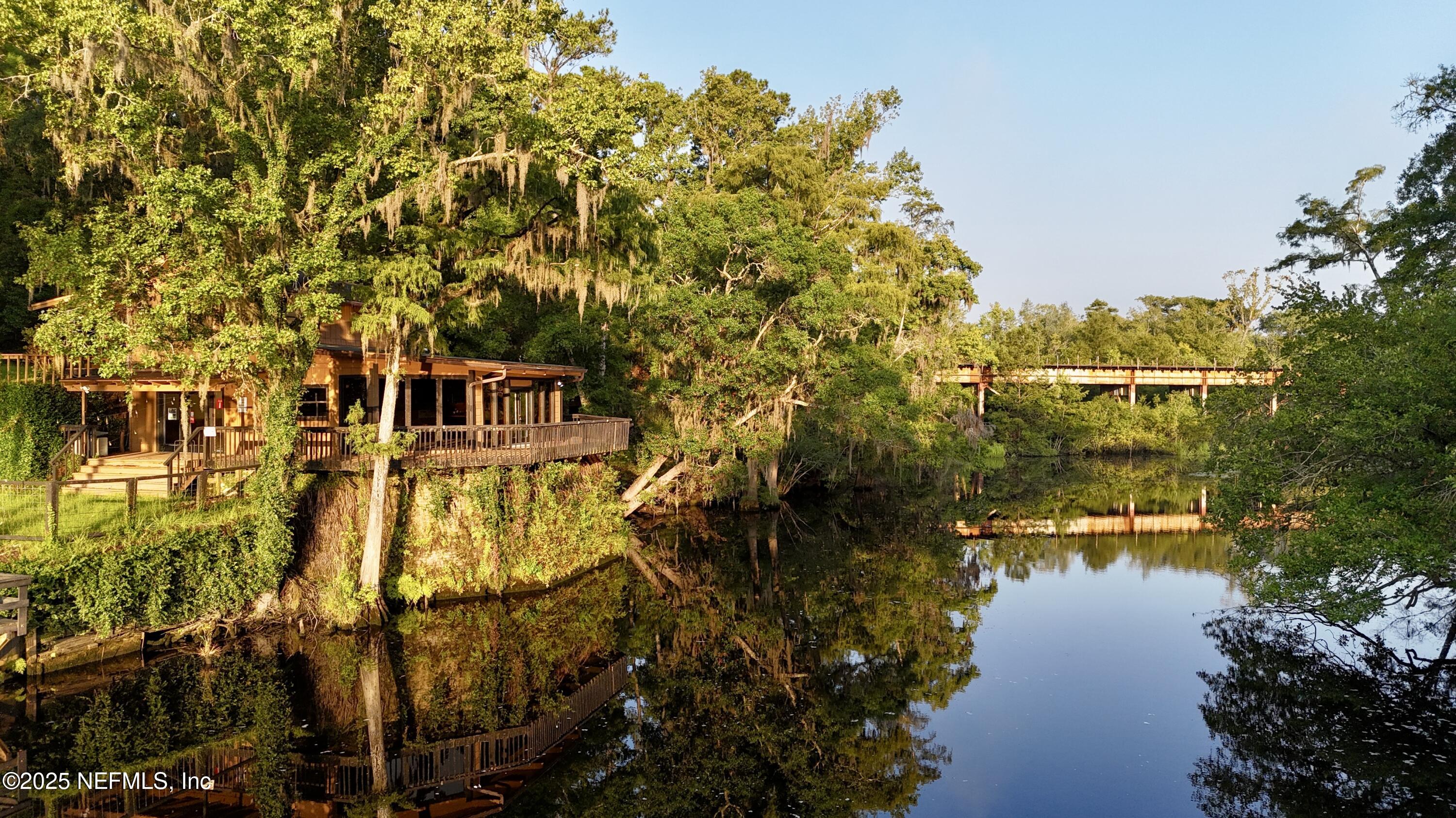 181040 Autumn Road Hilliard, FL 32046 - Photo 2 of 46 a view of a lake with a garden