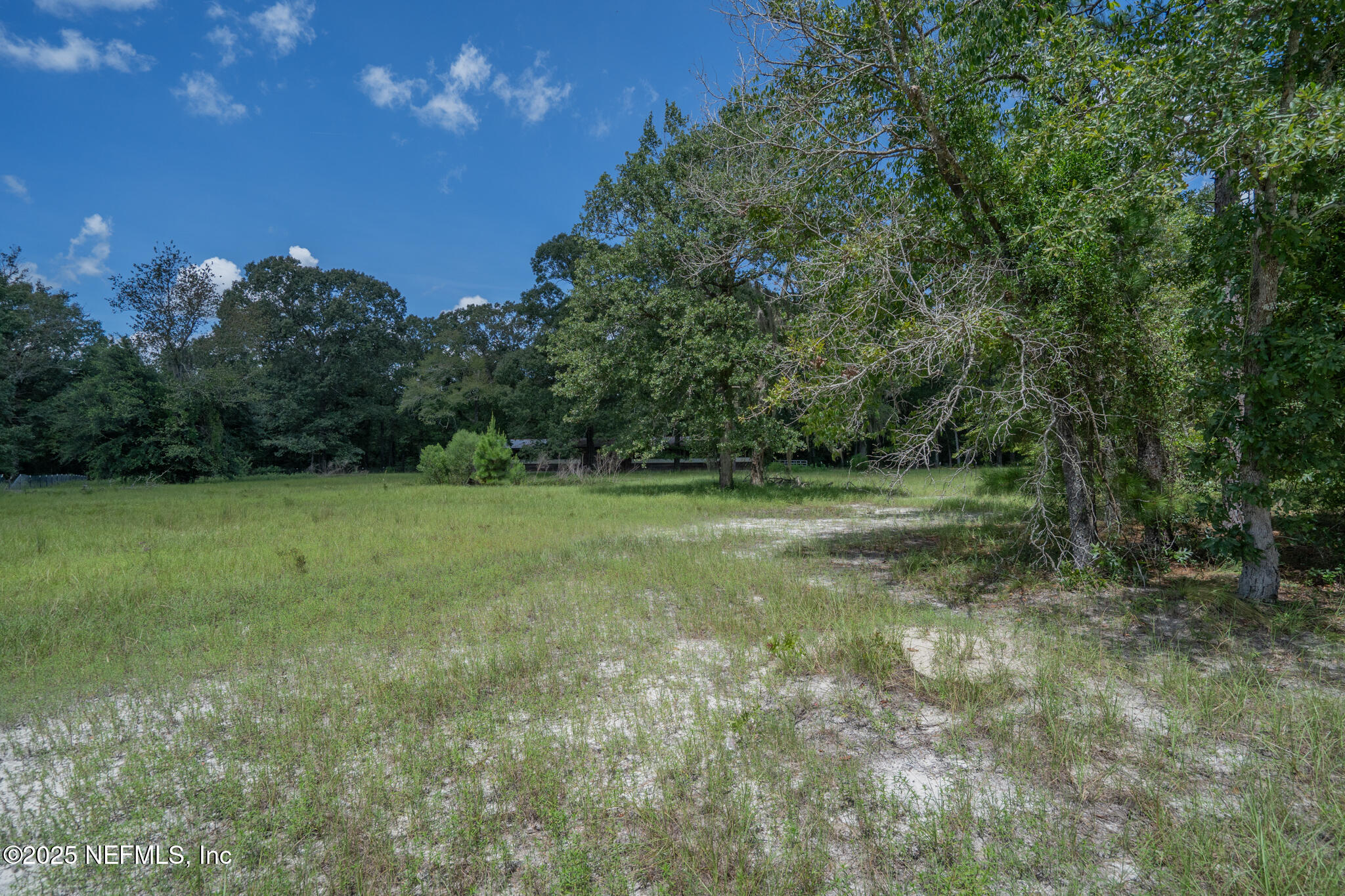 181040 Autumn Road Hilliard, FL 32046 - Photo 34 of 46 a view of outdoor space with deck and yard
