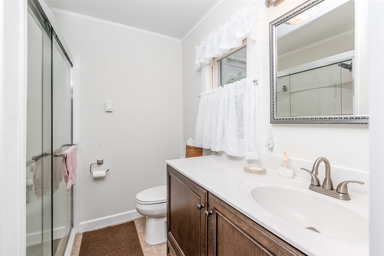939 Knightly Mill Road Mount Sidney, VA 24467 - Photo 34 of 50 a bathroom with a sink toilet and shower