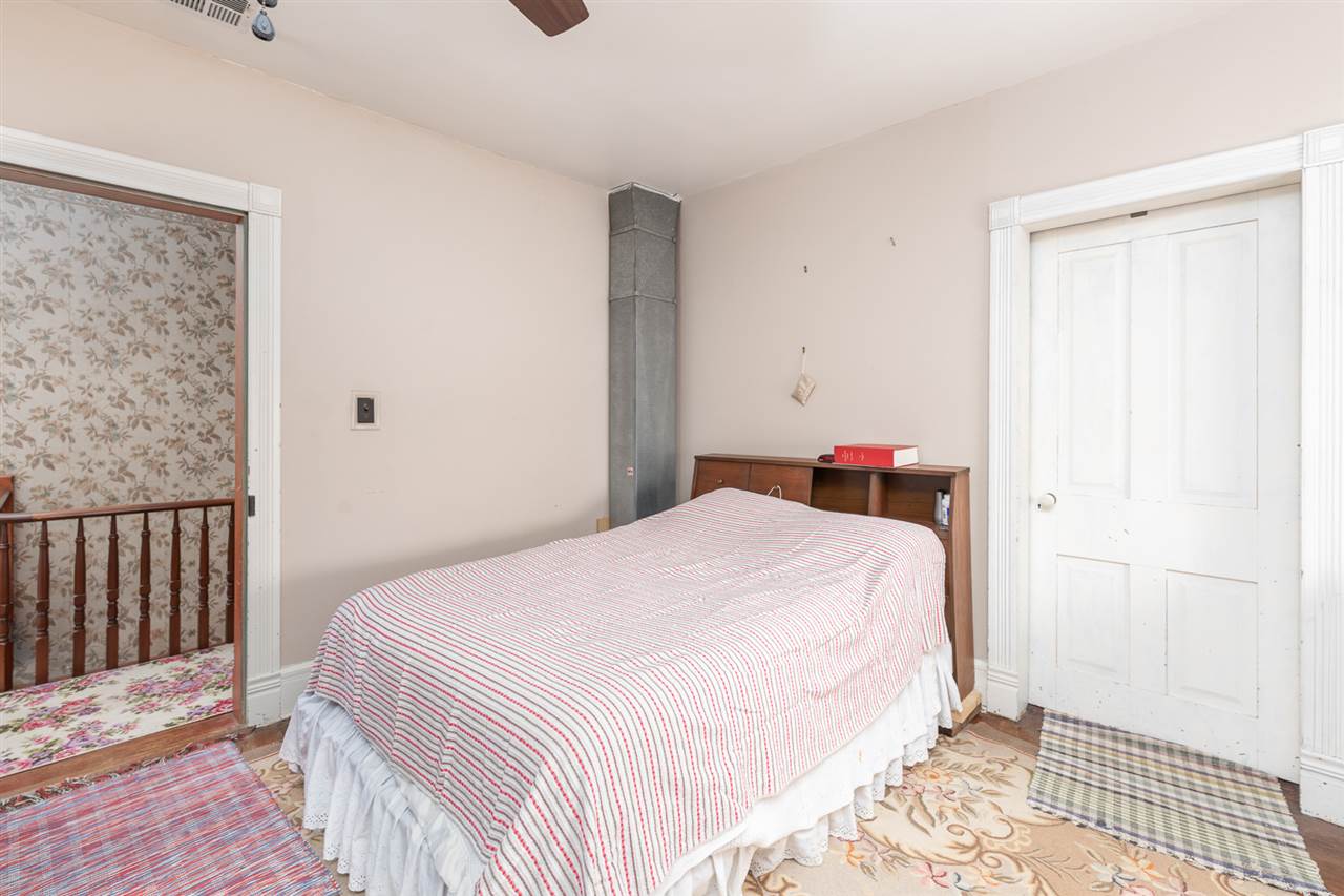 939 Knightly Mill Road Mount Sidney, VA 24467 - Photo 36 of 50 a bedroom with a bed and wooden floor