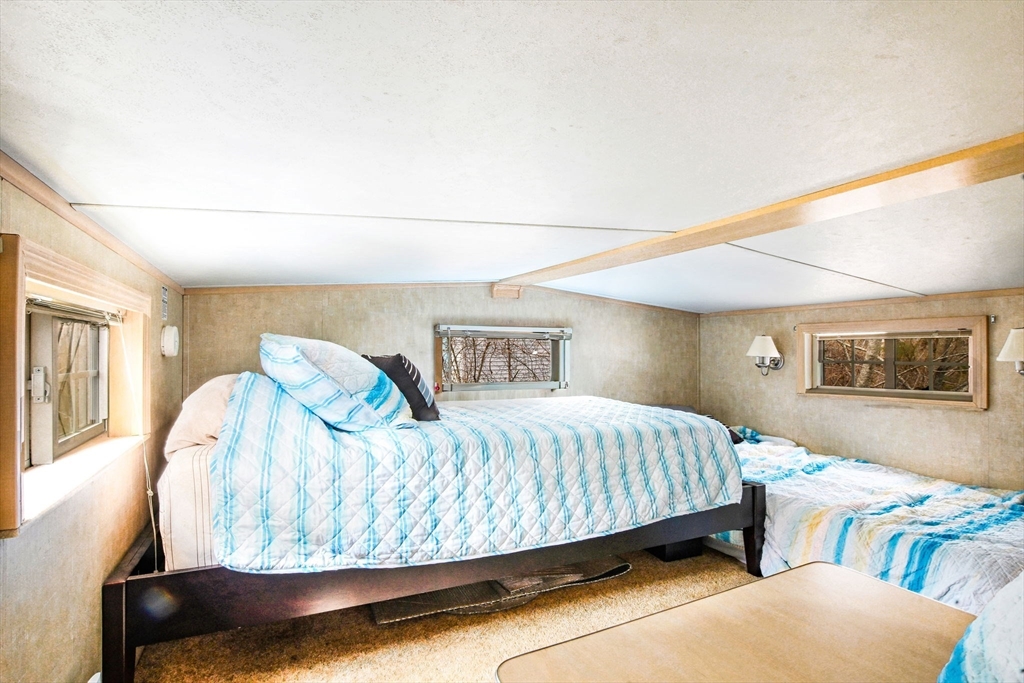 185 Cotuit Road, Unit 1 JUNIPER Sandwich, MA 02563 - Photo 11 of 20 a bedroom with a bed and window