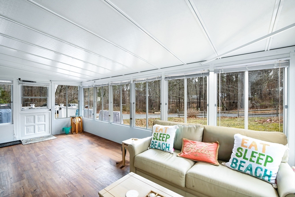 185 Cotuit Road, Unit 1 JUNIPER Sandwich, MA 02563 - Photo 5 of 20 a living room with furniture and a large window