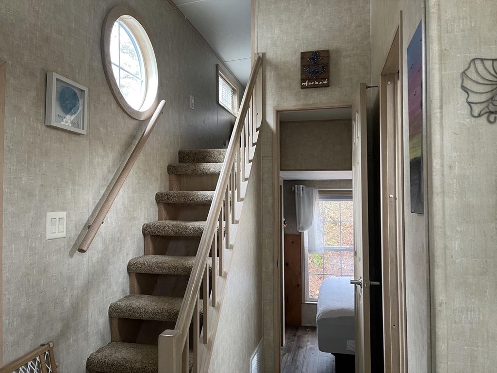 185 Cotuit Road, Unit 1 JUNIPER Sandwich, MA 02563 - Photo 9 of 11 a view of an entryway with wooden floor