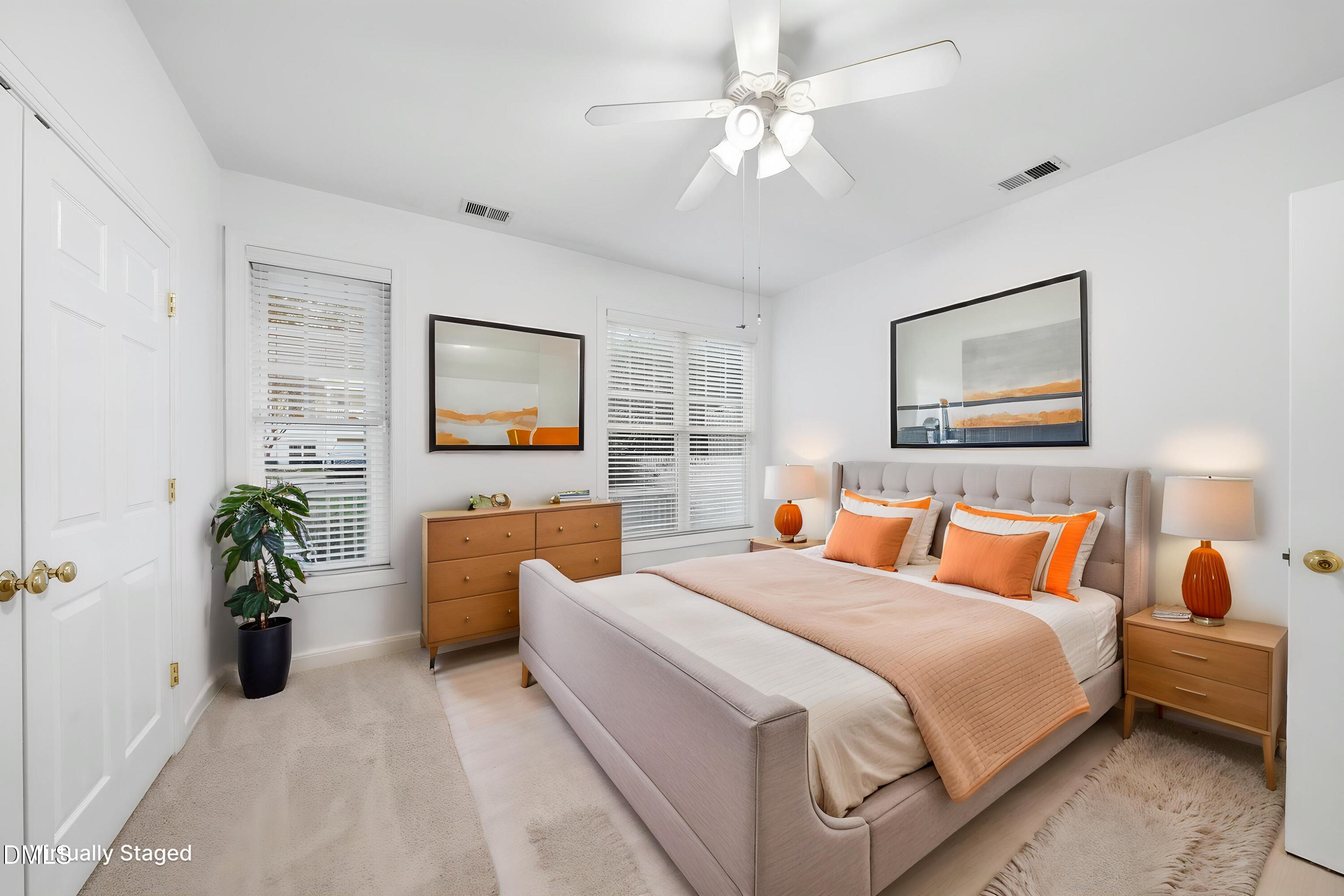 1301 Durlain Drive, Unit 105 Raleigh, NC 27614 - Photo 6 of 27 a bedroom with a large bed and a chandelier