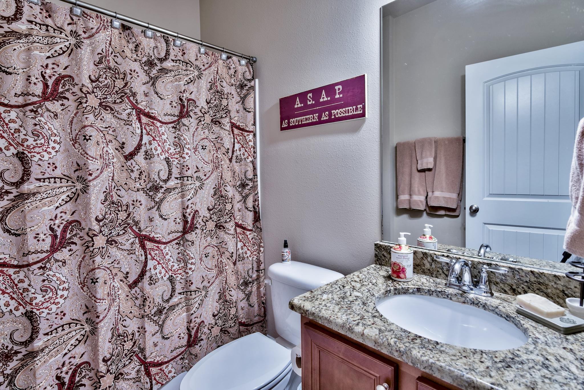 86 Pin Oak Loop Santa Rosa Beach, FL 32459 - Photo 18 of 28 a bathroom with a granite countertop sink and a mirror