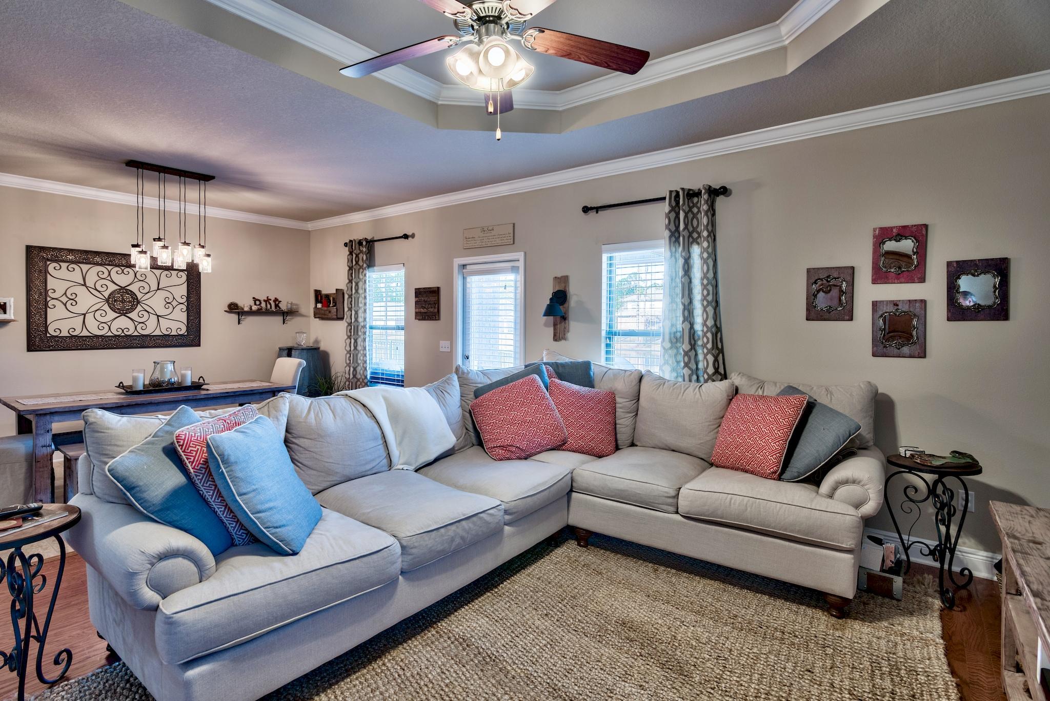 86 Pin Oak Loop Santa Rosa Beach, FL 32459 - Photo 10 of 28 a living room with furniture ceiling fan and a rug