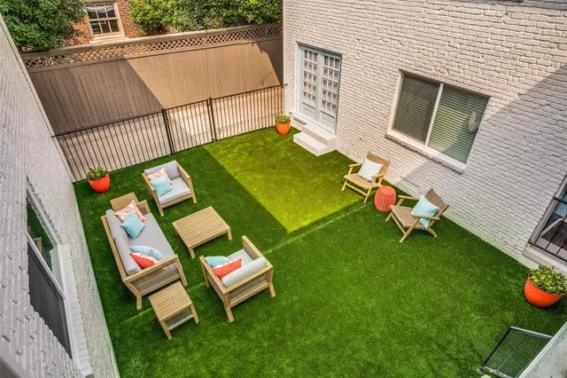 a view of backyard with a table and chairs