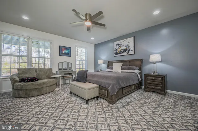 a bedroom with a bed and a couch