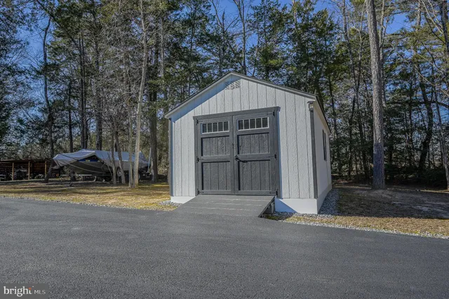 a view of a house with backyard and swimming pool