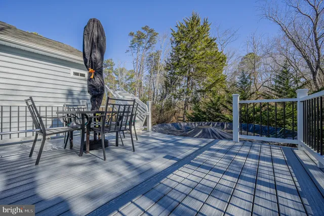a view of a chairs and table in the patio