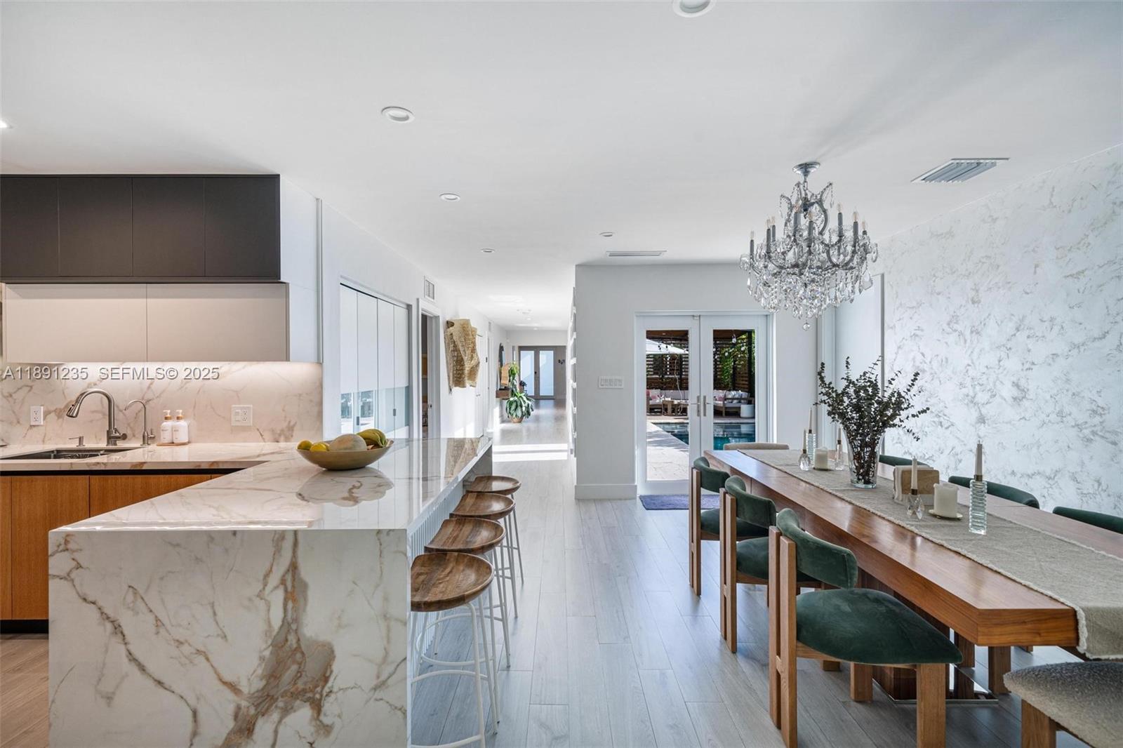 2437 Southwest 25th Terrace Miami, FL 33133 - Photo 11 of 32 a dining room with furniture and wooden floor