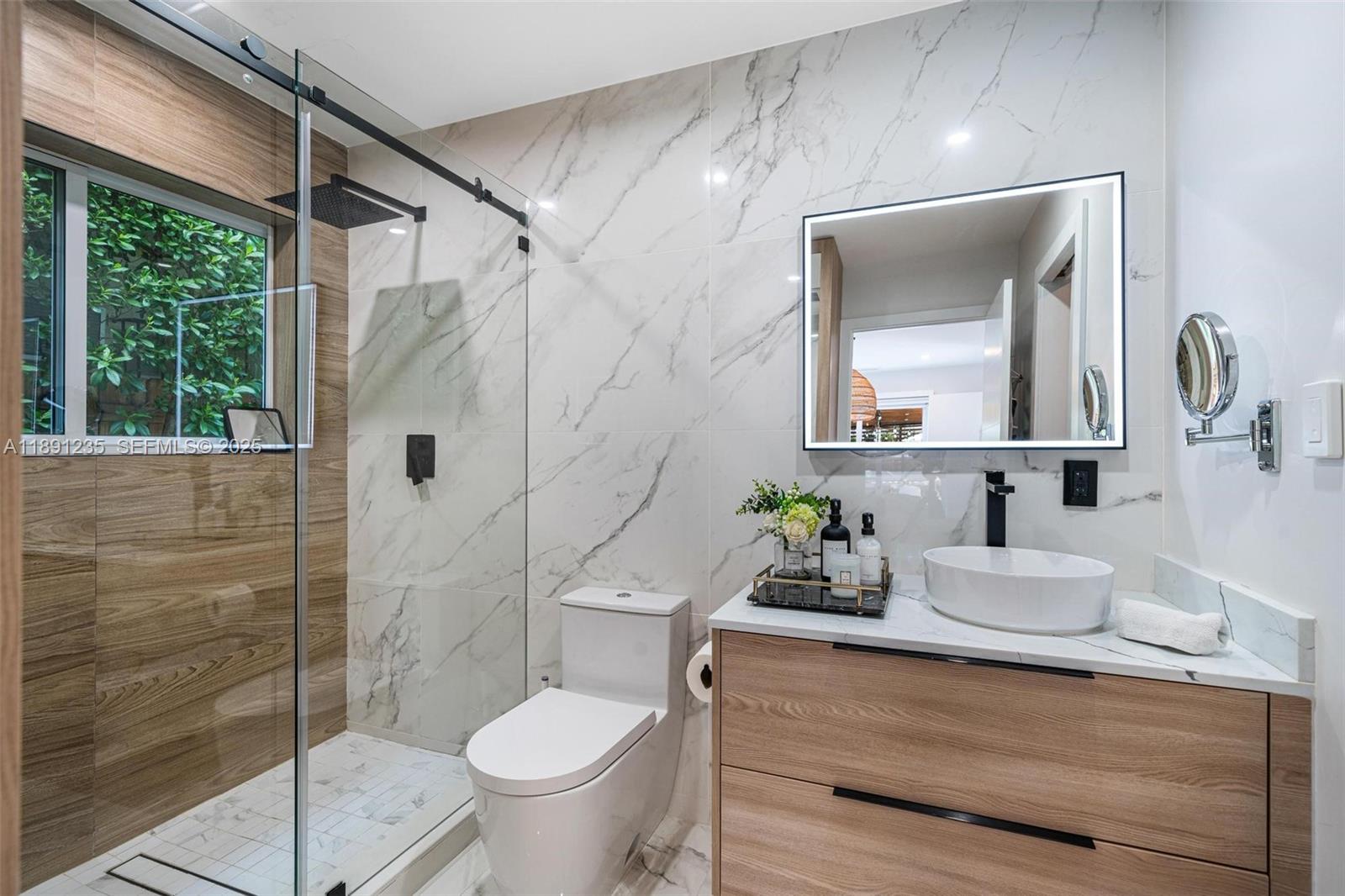 2437 Southwest 25th Terrace Miami, FL 33133 - Photo 15 of 32 a bathroom with a sink toilet and shower