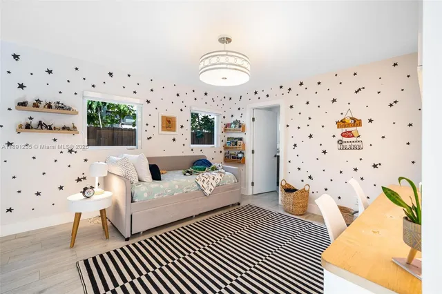 a spacious bedroom with a bed and a window