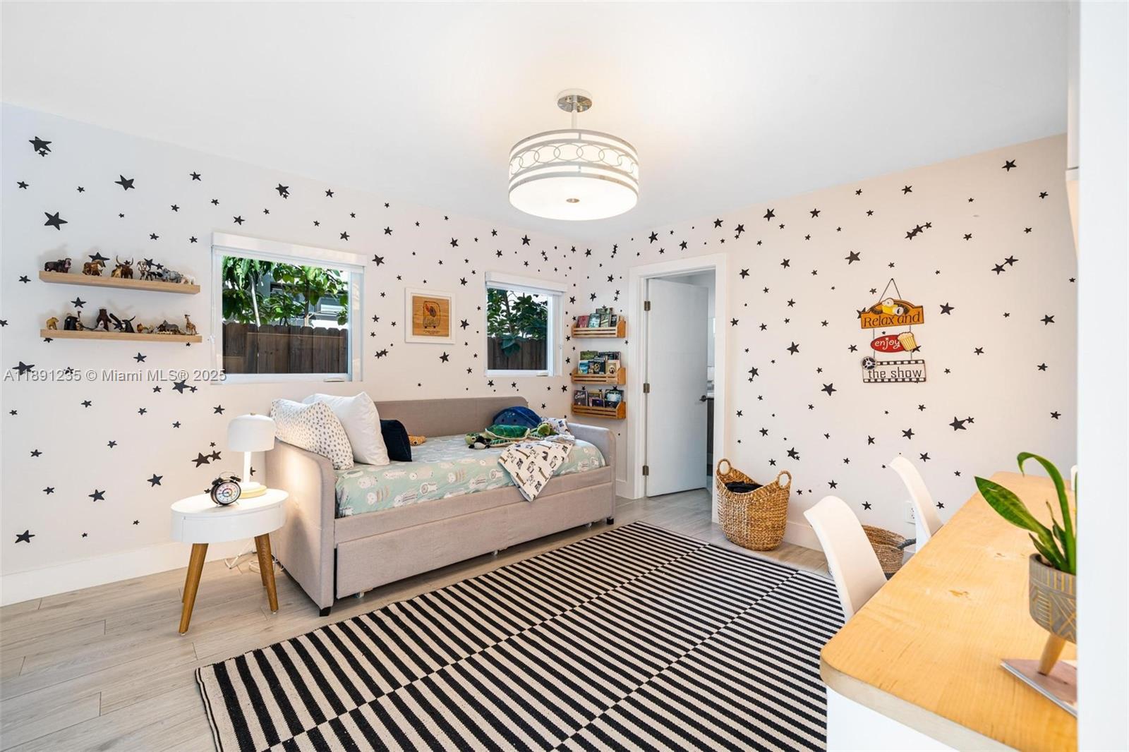 2437 Southwest 25th Terrace Miami, FL 33133 - Photo 17 of 32 a spacious bedroom with a bed and a window