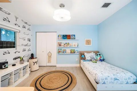 a bedroom with a bed and furniture