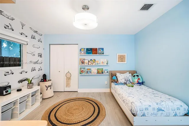 a bedroom with a bed and furniture