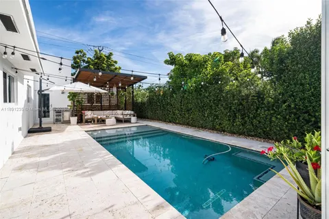 a view of a swimming pool with a patio