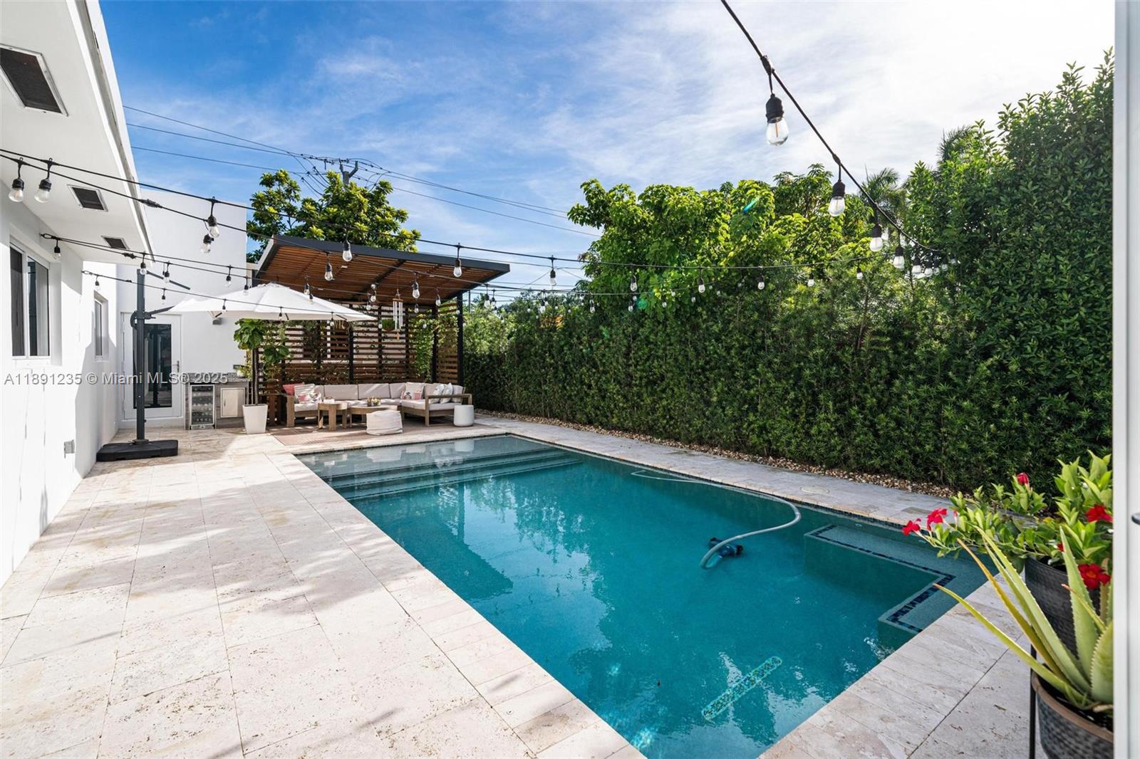 2437 Southwest 25th Terrace Miami, FL 33133 - Photo 25 of 32 a view of a swimming pool with a patio