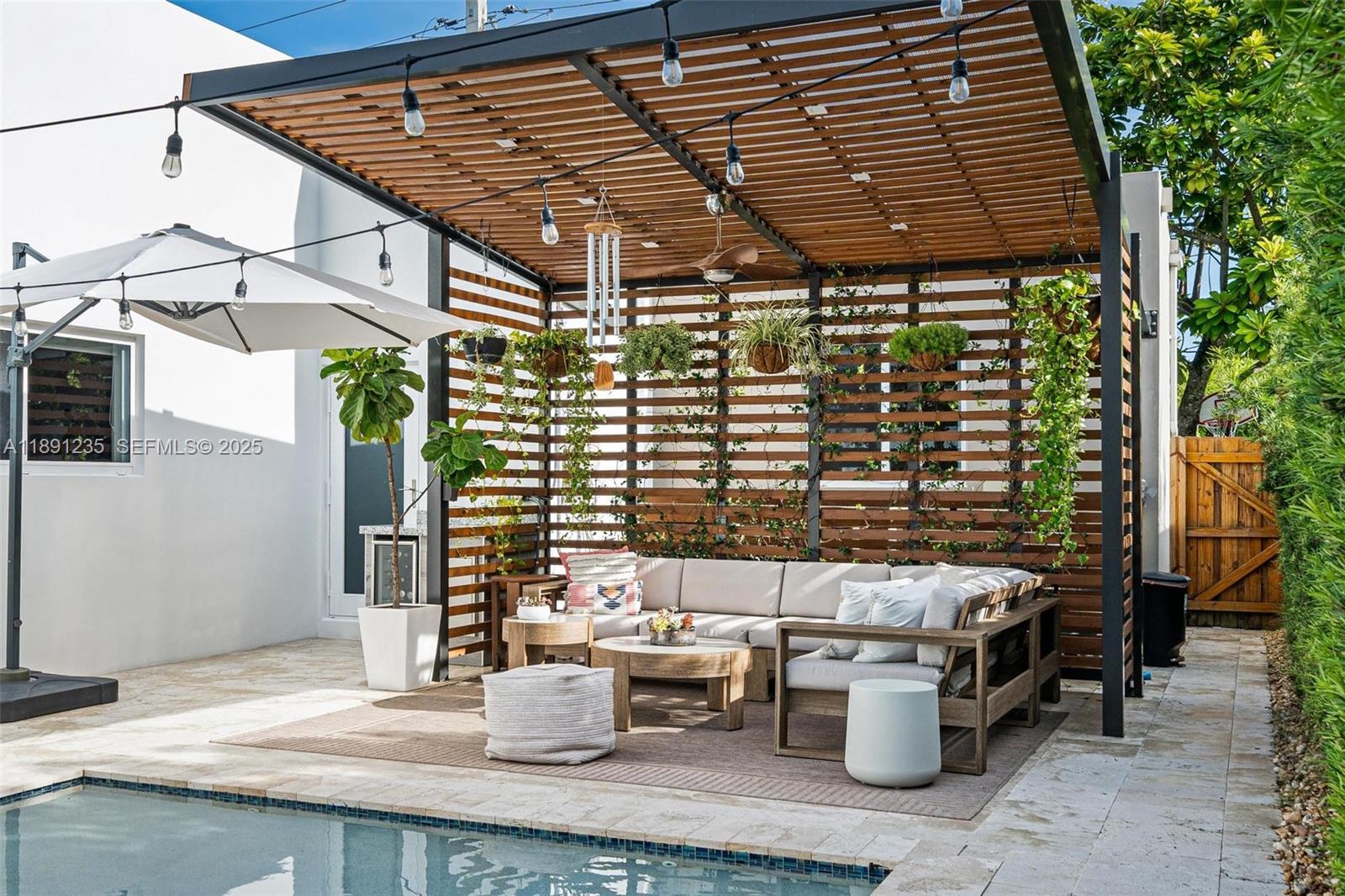 2437 Southwest 25th Terrace Miami, FL 33133 - Photo 27 of 32 a patio with glass top table and chairs