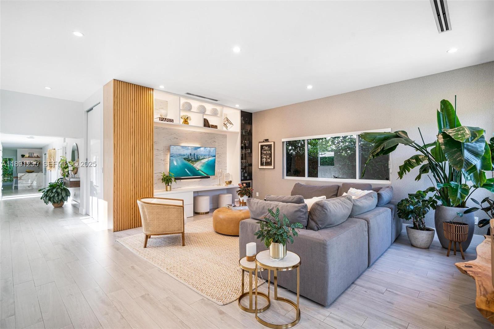 2437 Southwest 25th Terrace Miami, FL 33133 - Photo 3 of 32 a living room with furniture and a potted plant